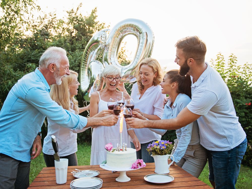 A family celebrate a 60th birthday in a garden