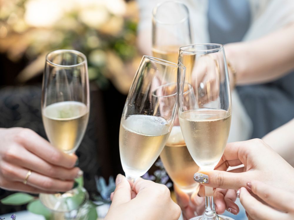 A group cheers glasses of Champagne